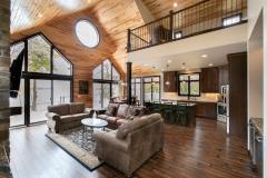 Kochmann Brothers Homes custom luxury lake living room with view of lake