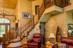 Kochmann Brothers Homes custom luxury lake home living room and stairs