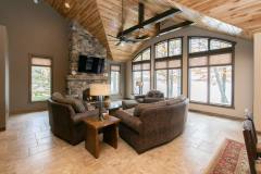 Kochmann Brothers Homes custom luxury lake living room with view of lake