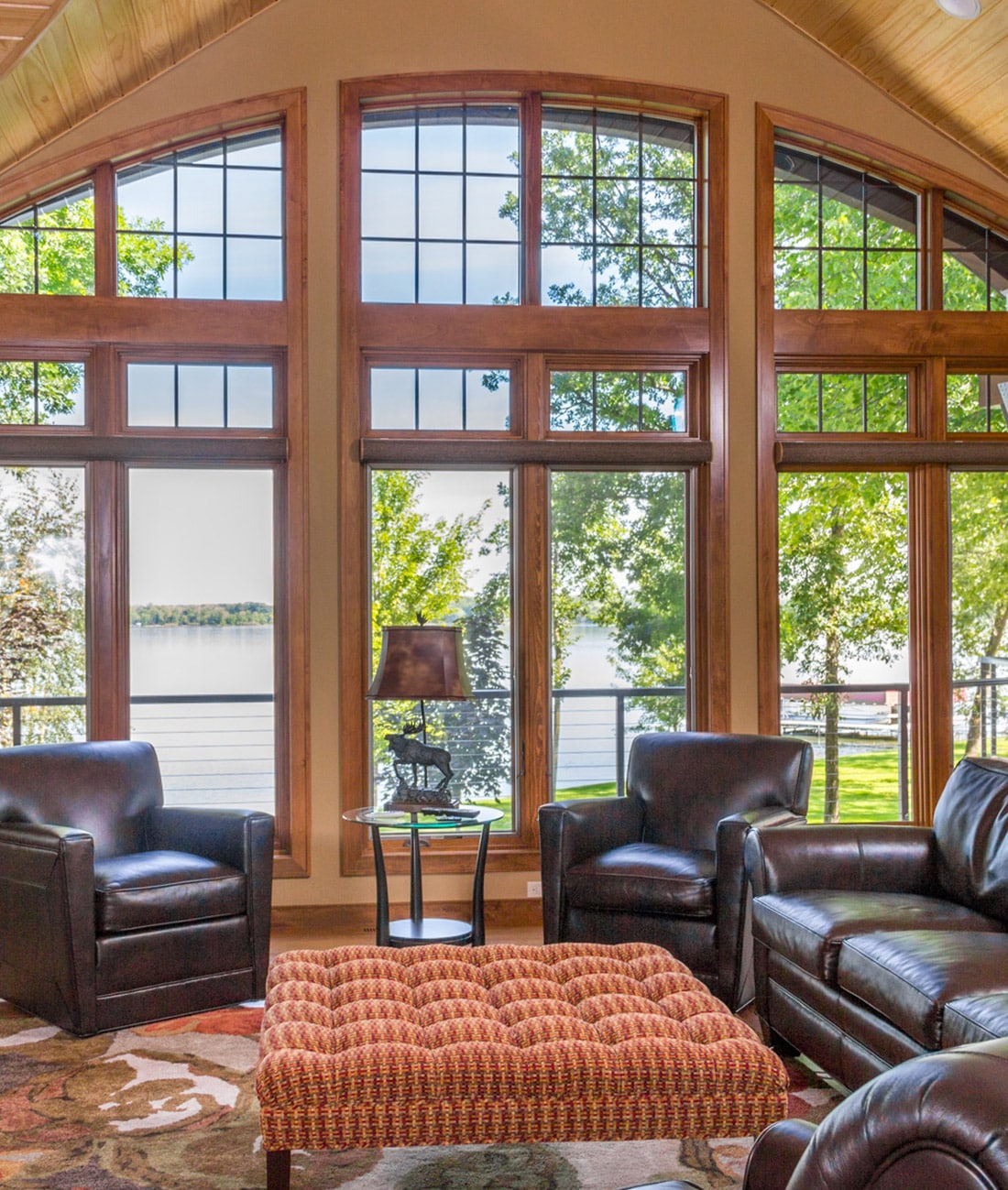 Building Custom Luxury Lake Homes - photo of lake cabin living room overlooking lake